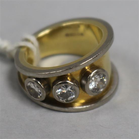 An 18ct gold three stone diamond ring